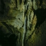The great mountain (Calvary) is an underground hall formed due to the collapse of the ceiling, proof of which is a mound of collapse rocks and debris. The ceiling reveals precisely where individual limestone layerscollapsed. Water seeps through the cracks and deposits calcite in the form of speleothems on the ceiling. On account of crumbling, the stalactites are smaller and younger, while the ground is covered in giant stalagmites over half a million years old. The top of the Great Mountain offers an amazing view, in particular of the Russian Bridge. Located at the foothills of the Great Mountain there is the exit station of the cave railway, where visitors leave the train and continue the tour on foot.
